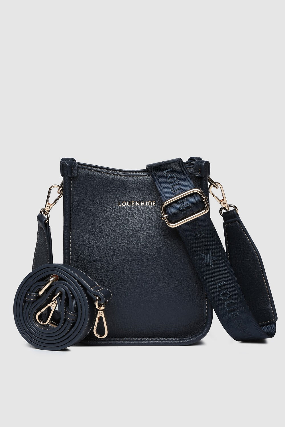 Navy handbag with gold accents on a light gray background