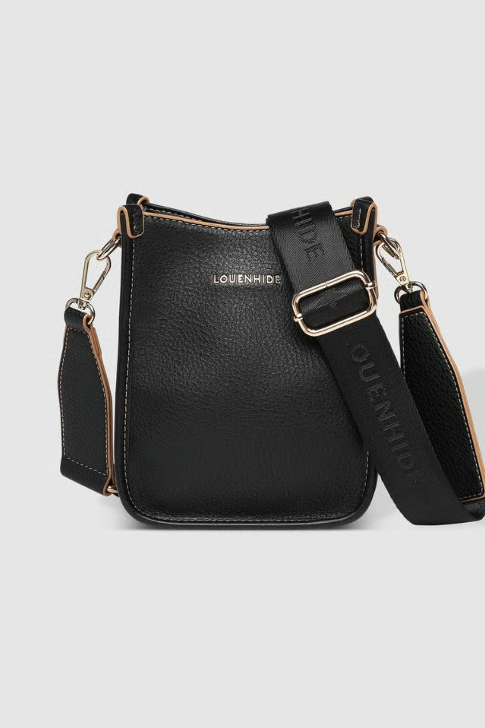 A black pebbled leather crossbody bag with gold-tone hardware, and a wide adjustable shoulder strap printed with 'LOUENHIDE' and a star. The brand name 'LOUENHIDE' is embossed on the front.