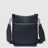 A navy pebbled leather crossbody bag with gold-tone hardware, and a wide adjustable shoulder strap.