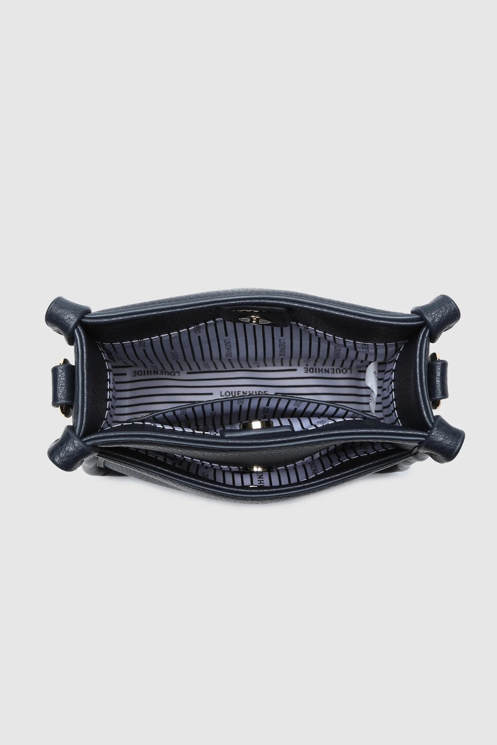 Looking down into a navy bag with a white and black striped lining.
