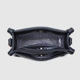 Looking down into a navy bag with a white and black striped lining.
