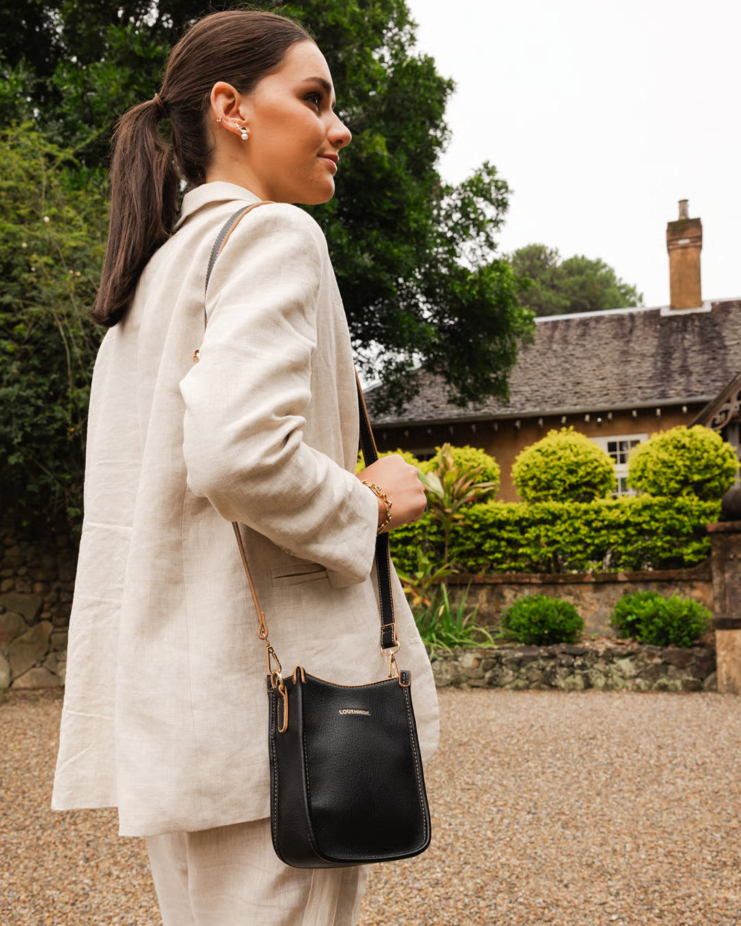 The Louenhide Parker Phone Crossbody Bag effortlessly combines an elevated aesthetic with everyday functionality. Whether you're heading to the office, running errands or meeting friends for coffee, this minimalistic phone bag will be your new go-to. Parker features an on-trend and modern silhouette, enhanced by the contrasting stitch details in two classic colourways. Elevate your style with the sateen webbing guitar strap or keep it simple with the matching vegan leather crossbody strap. Keeping your esse