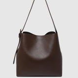 A dark brown leather hobo shoulder bag with a single strap and a subtle embossed logo on the front, shown against a light gray background.