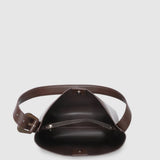 A dark brown leather bag shown from a top-down view on a light gray background.