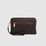 Brown handbag with gold zipper on a light gray background
