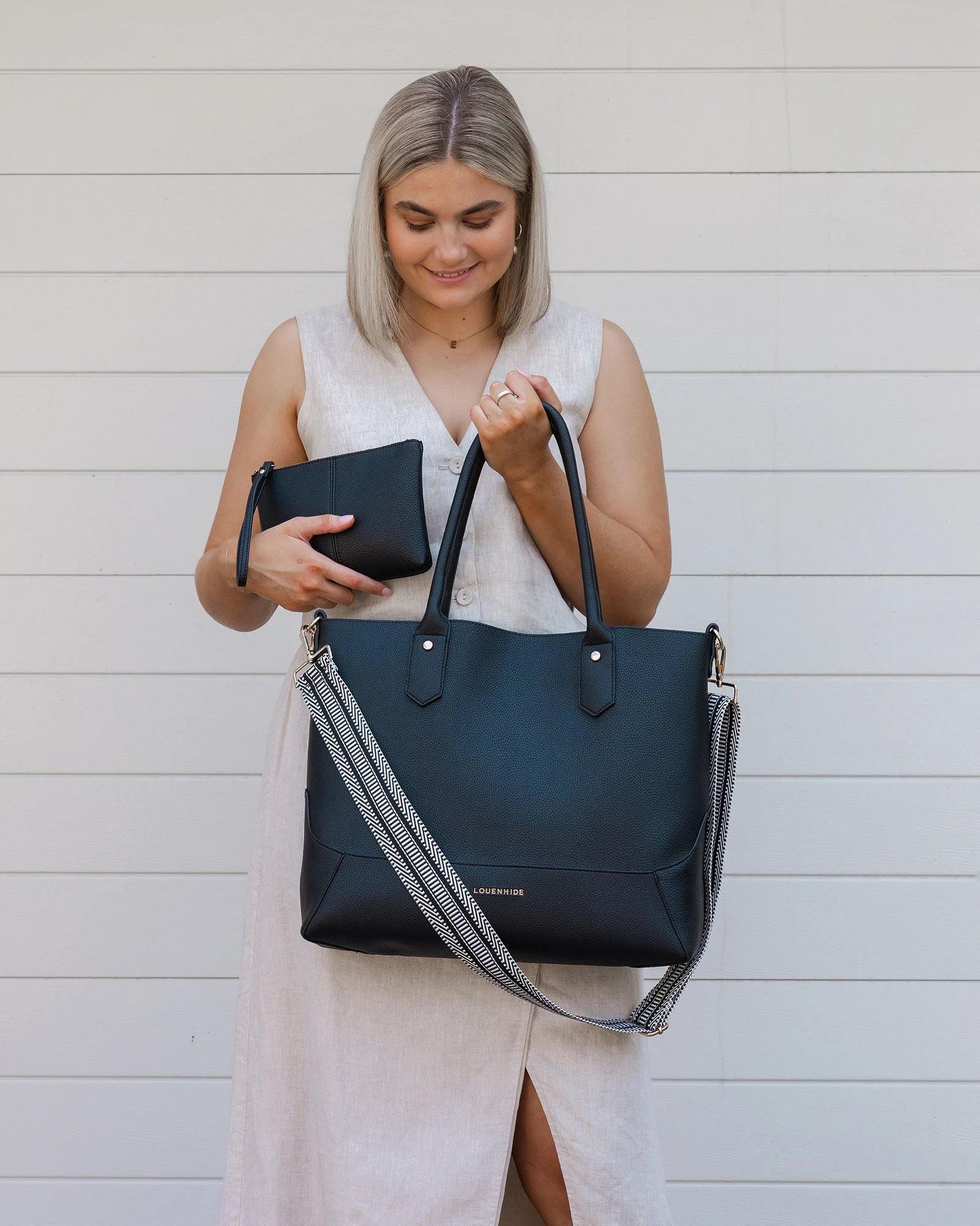 The Louenhide Portsea Tote Bag is a relaxed silhouette that is perfect for everyday wear. This versatile design also doubles as a casual work bag that adds a pop of fun to your corporate looks. Soft yet structured, this bag is perfect for women on-the-go. Featuring a luxurious suedette lining, vegan leather exterior with light gold hardware detailing, this shoulder bag is spacious and functional with enough room to carry all your essentials and more!