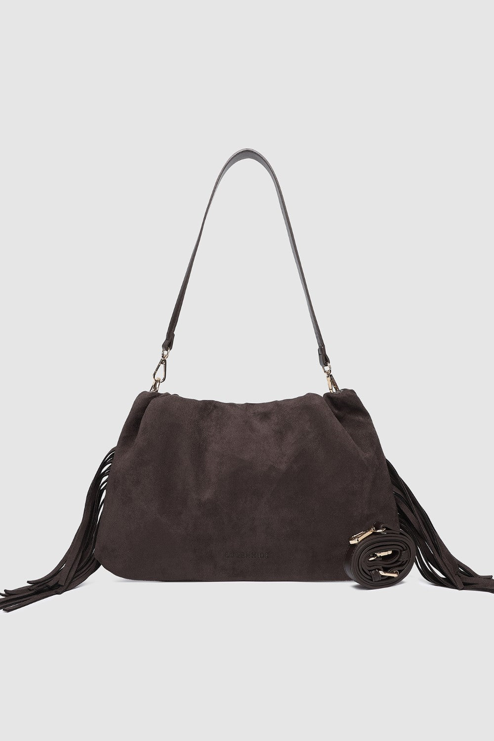 Brown suede handbag with fringes on a light gray background