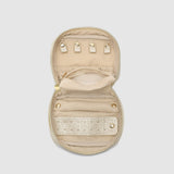Open champagne coloured jewellery case on white background