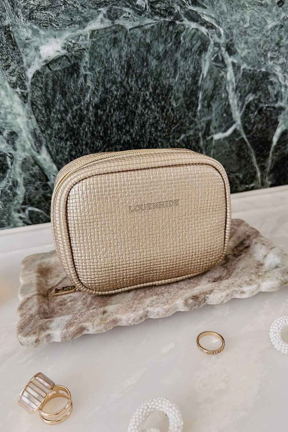 Champagne coloured jewellery case on vanity setting background