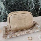 Champagne coloured jewellery case on vanity setting background