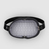 Black bag with patterned lining on a light gray background