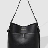 Black handbag with a visible brand name on a light gray background