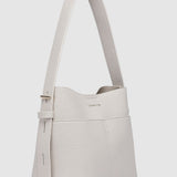 Light handbag with a strap on a white background