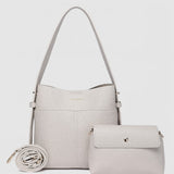 Light handbag with matching pouch on a white background