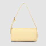 Yellow handbag with a strap on a light gray background