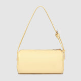 Yellow handbag with a strap on a light gray background