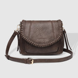 The Louenhide Shania Crossbody Bag is the epitome of elevated style that complements any ensemble. This casual women’s crossbody bag features a subtle woven vegan leather trim that adds a touch of effortless sophistication to your capsule wardrobe. 