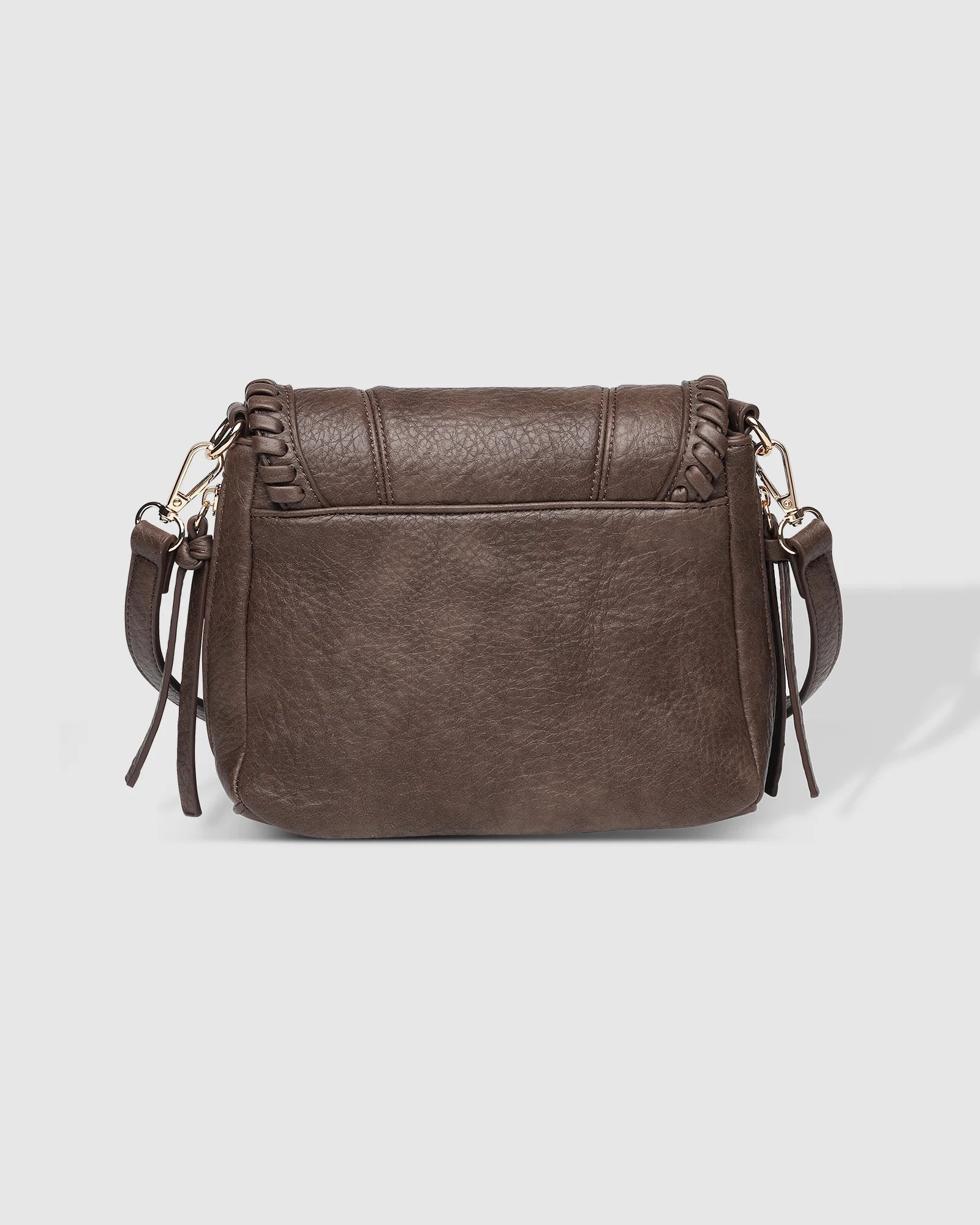 The Louenhide Shania Crossbody Bag is the epitome of elevated style that complements any ensemble. This casual women’s crossbody bag features a subtle woven vegan leather trim that adds a touch of effortless sophistication to your capsule wardrobe. 