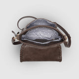 The Louenhide Shania Crossbody Bag is the epitome of elevated style that complements any ensemble. This casual women’s crossbody bag features a subtle woven vegan leather trim that adds a touch of effortless sophistication to your capsule wardrobe. 