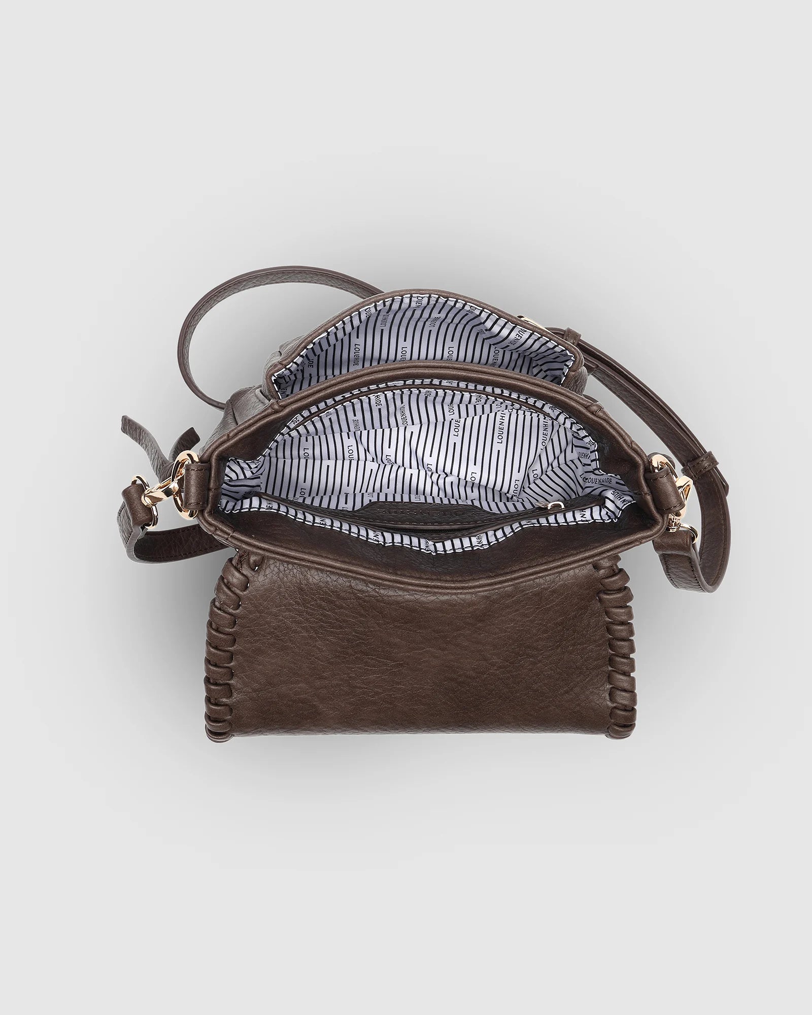 The Louenhide Shania Crossbody Bag is the epitome of elevated style that complements any ensemble. This casual women’s crossbody bag features a subtle woven vegan leather trim that adds a touch of effortless sophistication to your capsule wardrobe. 