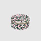 A round zippered jewelry organizer case with a green, pink, and white pattern on a white background.