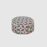 A round zippered jewelry organizer case with a green, pink, and white pattern on a white background.