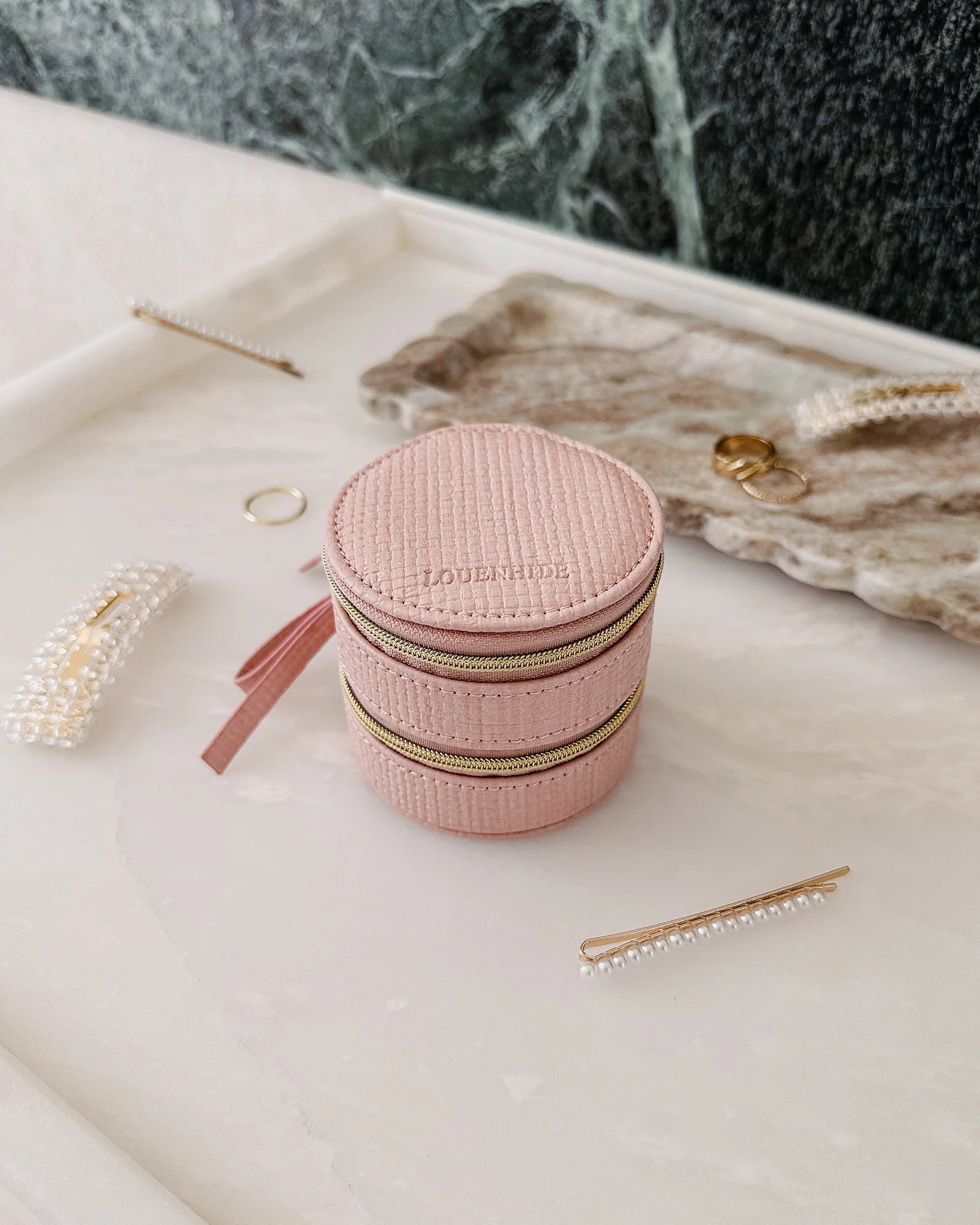 The Louenhide Sofia Jewelry Box is designed to hold and protect your most treasured pieces. Featuring a compact silhouette with two protective compartments, this multi-zipper case offers a streamlined way to store your jewellery without taking up unnecessary space. This travel jewellery case is the perfect addition to your bag, ensuring valuables stay secure and organised wherever the day leads.