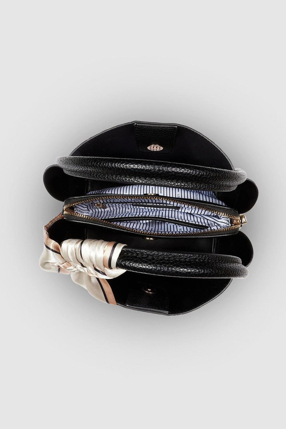 Black pleather bag on a white background