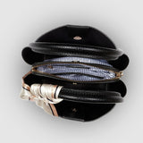 Black pleather bag on a white background