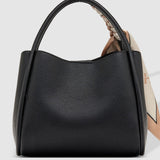 Black handbag on a light gray background