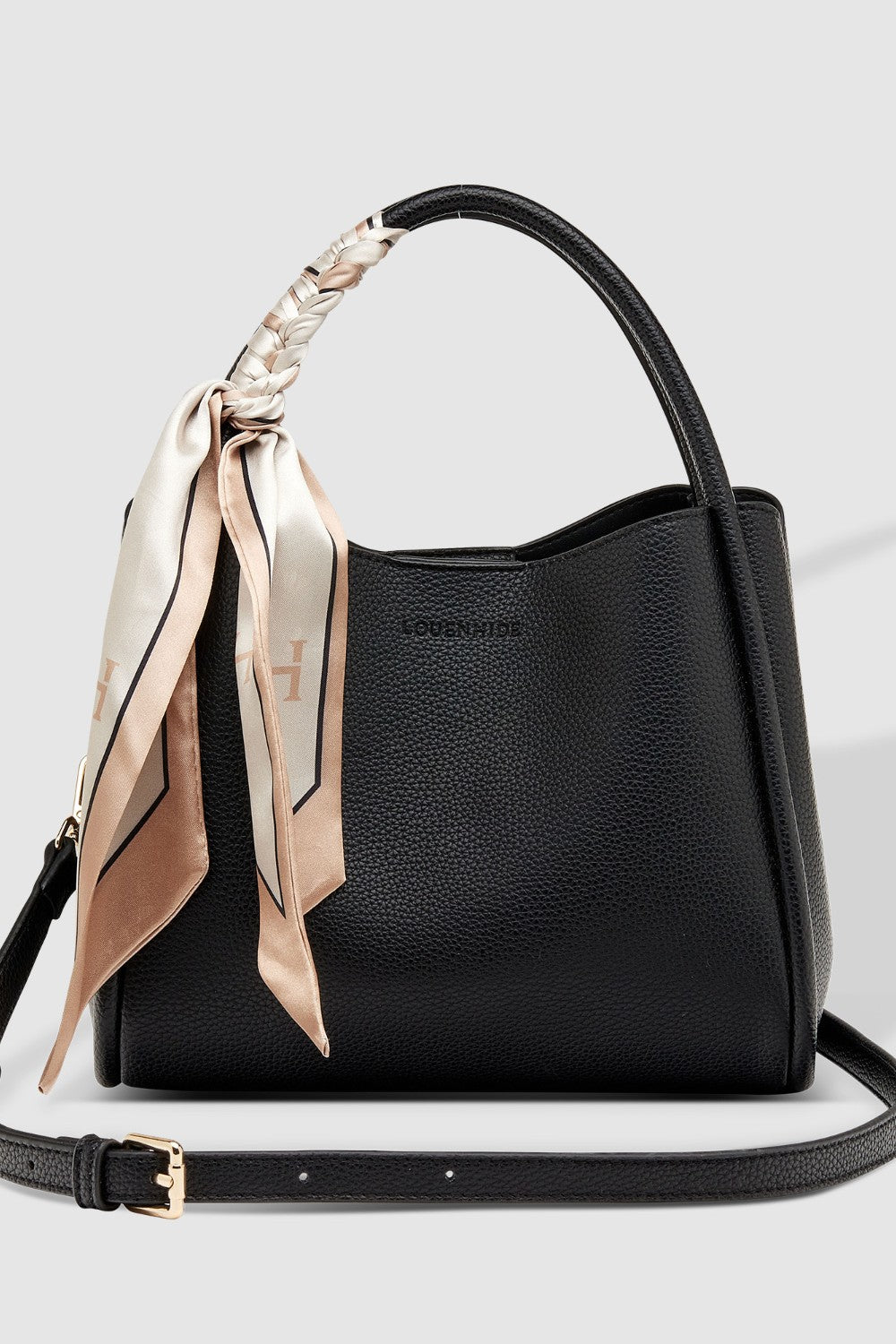 Black handbag with a decorative ribbon on a light gray background