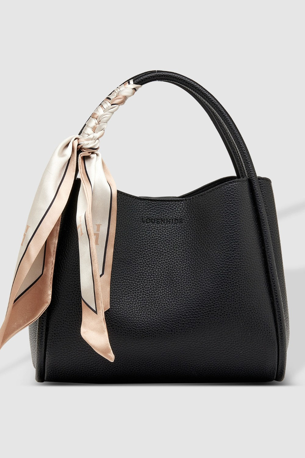 Black handbag with a decorative scarf on a light gray background