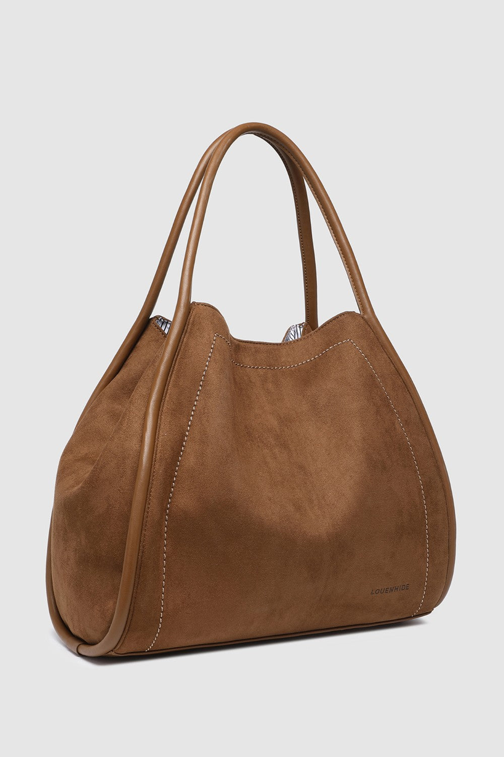 Brown pleather handbag on a light gray background
