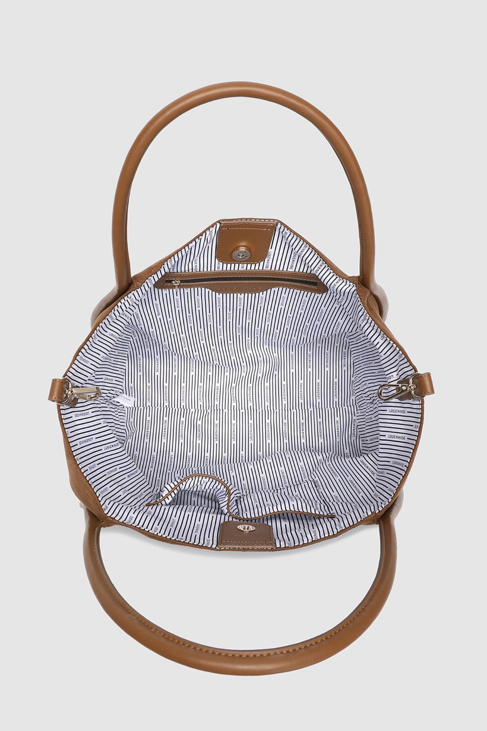 Brown handbag with a striped interior on a light gray background