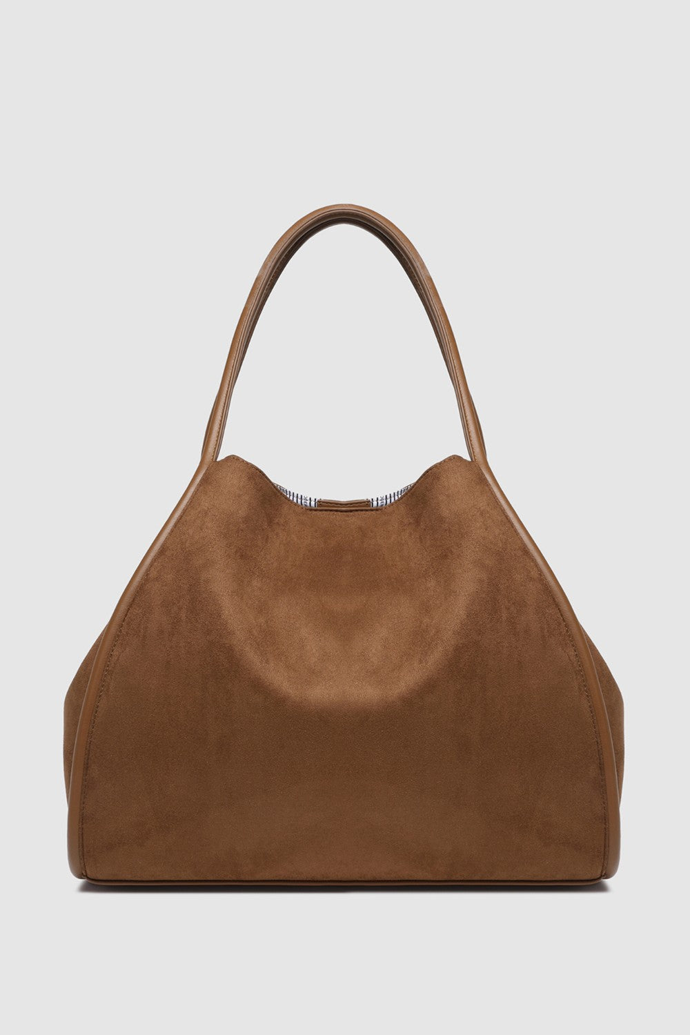 Brown suede handbag on a light gray background