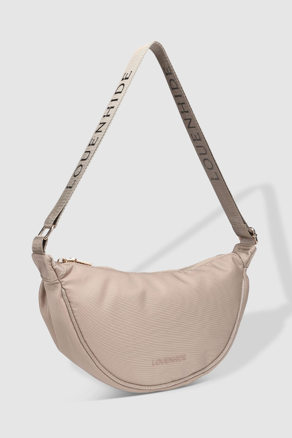 Beige handbag with a strap on a light gray background