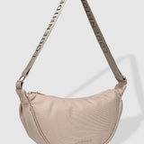 Beige handbag with a strap on a light gray background