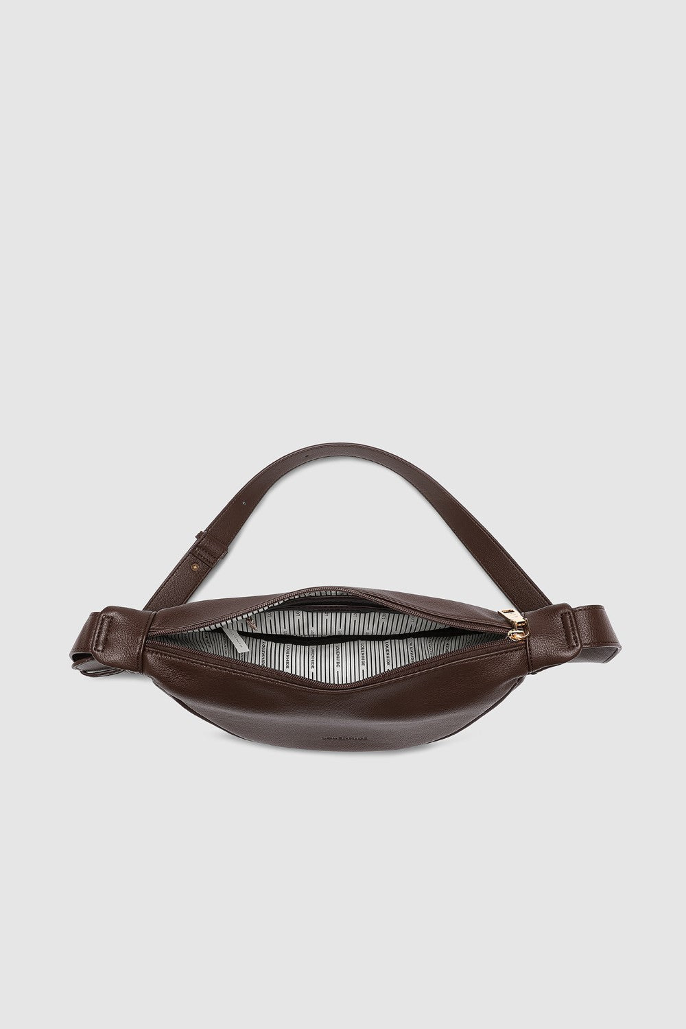 Brown pleather bag on a light gray background