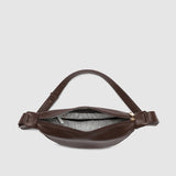 Brown pleather bag on a light gray background