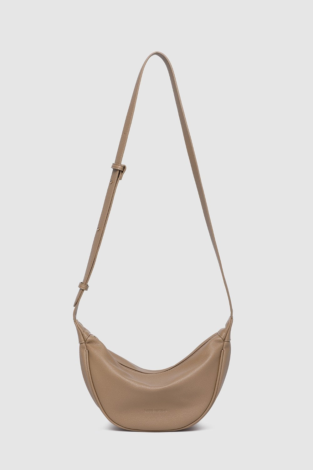 Beige handbag with a strap on a white background