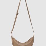 Beige handbag with a strap on a white background
