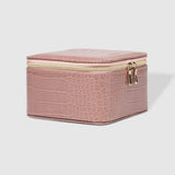 The Louenhide Tara Croc Jewelry Box is a large, square jewellery box designed to keep your bespoke pieces safe and secure at home or when you are on the go. Featuring a croc-like vegan leather exterior, this women's jewellery box boasts ample space with its two large compartments, one elastic slip pocket and four ring rolls. Fit all your favourite jewels, including rings, necklaces and bracelets inside. You'll also love the removable tray revealing enough room for larger statement pieces.