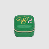 Green jewelry box with a shell design on a light gray background