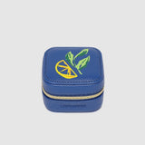 Blue jewelry box with a green and yellow design on a light gray background