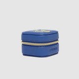 Blue jewelry box with gold zipper on a light gray background