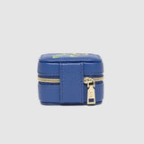 Blue jewelry box with gold zipper on a light gray background