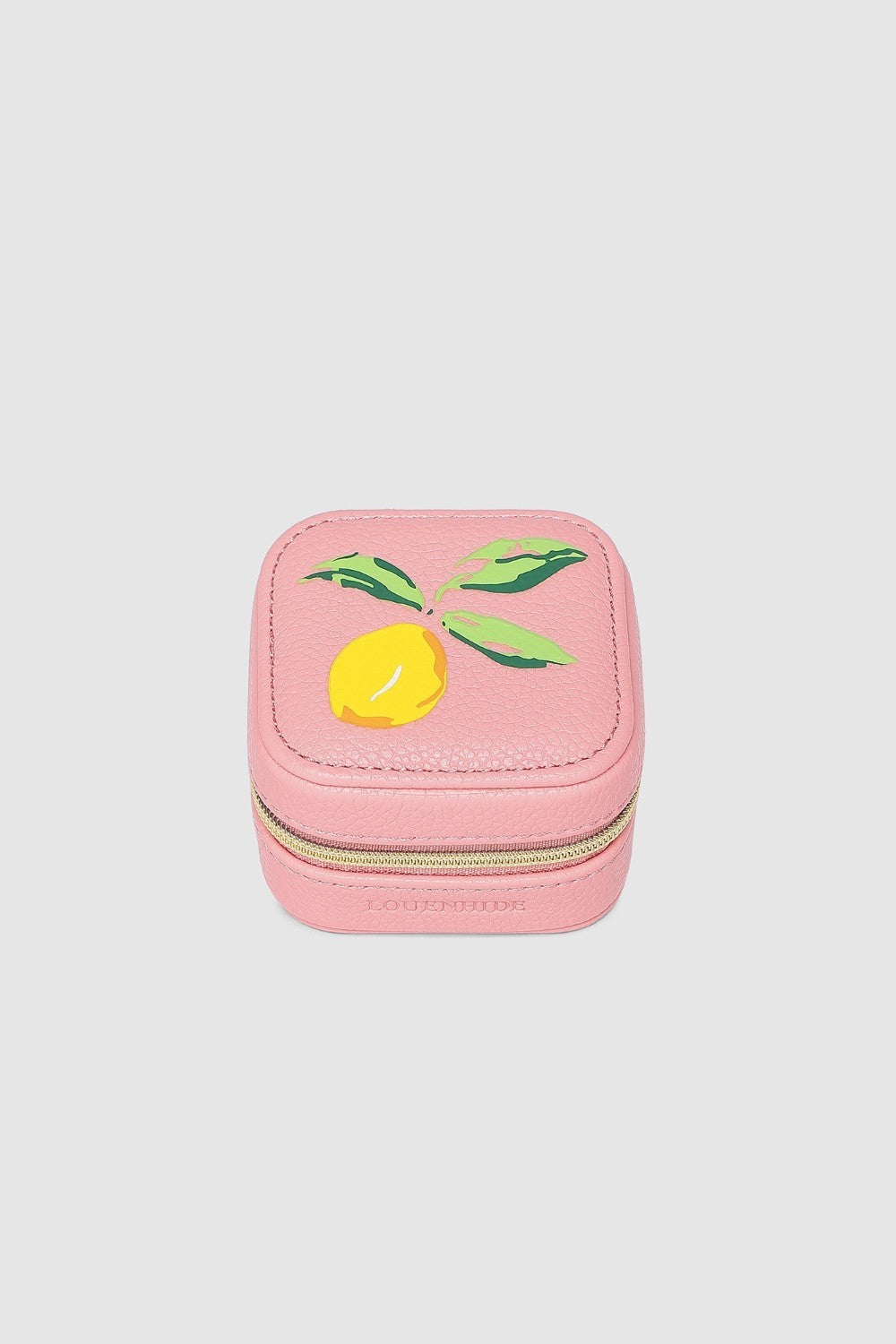 Pink jewelry box with a lemon design on a light gray background