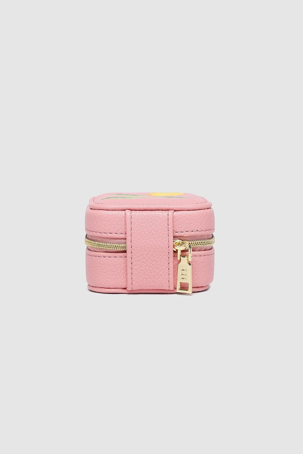 Pink jewelry box with gold zipper on a light gray background