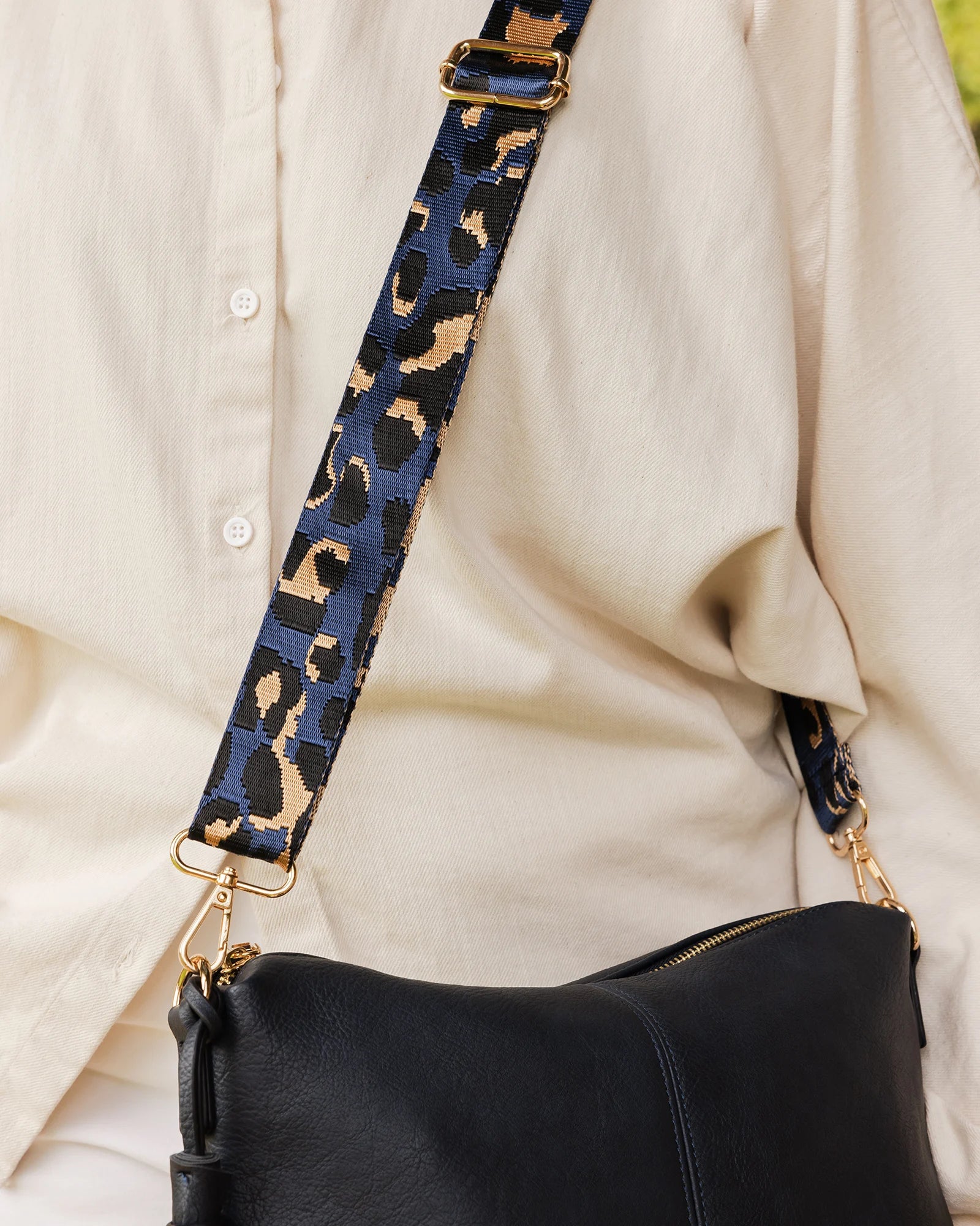 The Louenhide Tyler Bag Strap is a fun statement strap, created in a vibrant metallic animal print. Constructed with soft sateen webbing and finished with vegan leather and light gold hardware, this adjustable strap is a gorgeous way to switch up your look.