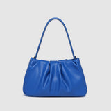 Blue handbag on a light gray background